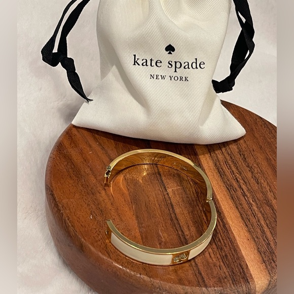 Kate Spade Gold Tone Hole Punch Spade Cream Enamel Bangle - Picture 2 of 3